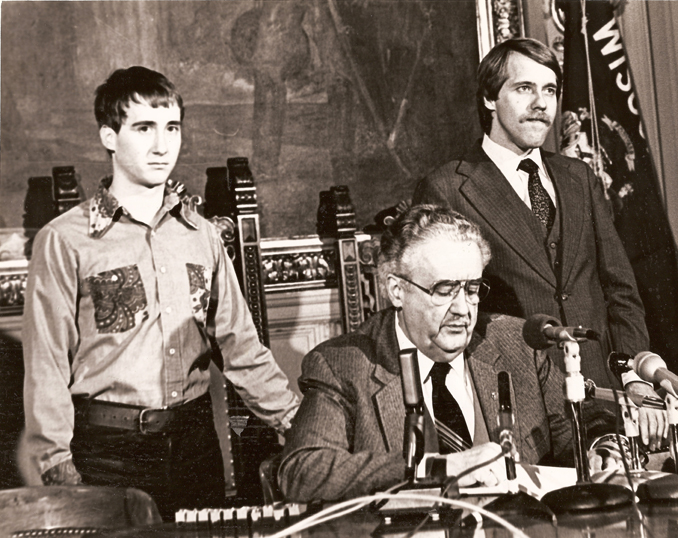 Photo of the signing of AB70 into law by Governor Lee Dreyfus, February 1982 / Left to right: Leon Rouse, Governor Dreyfus, David Clarenbach /
