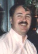 Robert and partner Ross appear in this Dec. 1990 photo / of the Board of Directors of the Cream City Foundation